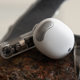 A close-up of one Nothing Ear (stick) earbud.